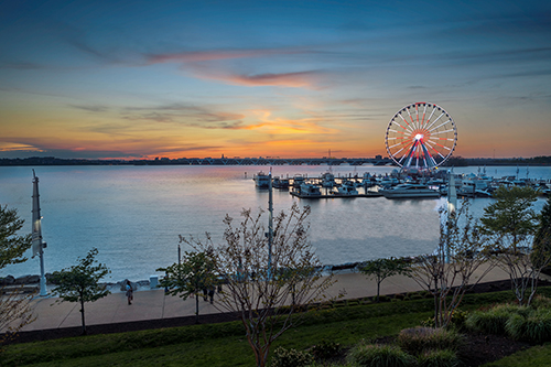 Ferris wheel at National Harbor in Maryland with boats and water